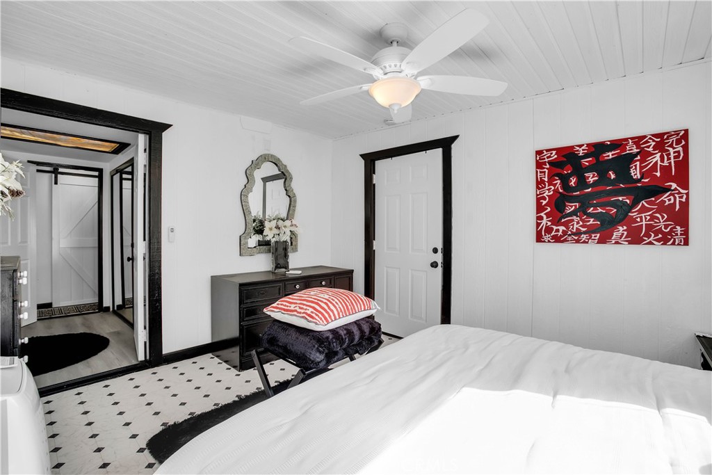 49490 Big Morongo Canyon Road Morongo Valley, CA 92256 - Photo 24 of 75 a bedroom with two beds and a chandelier