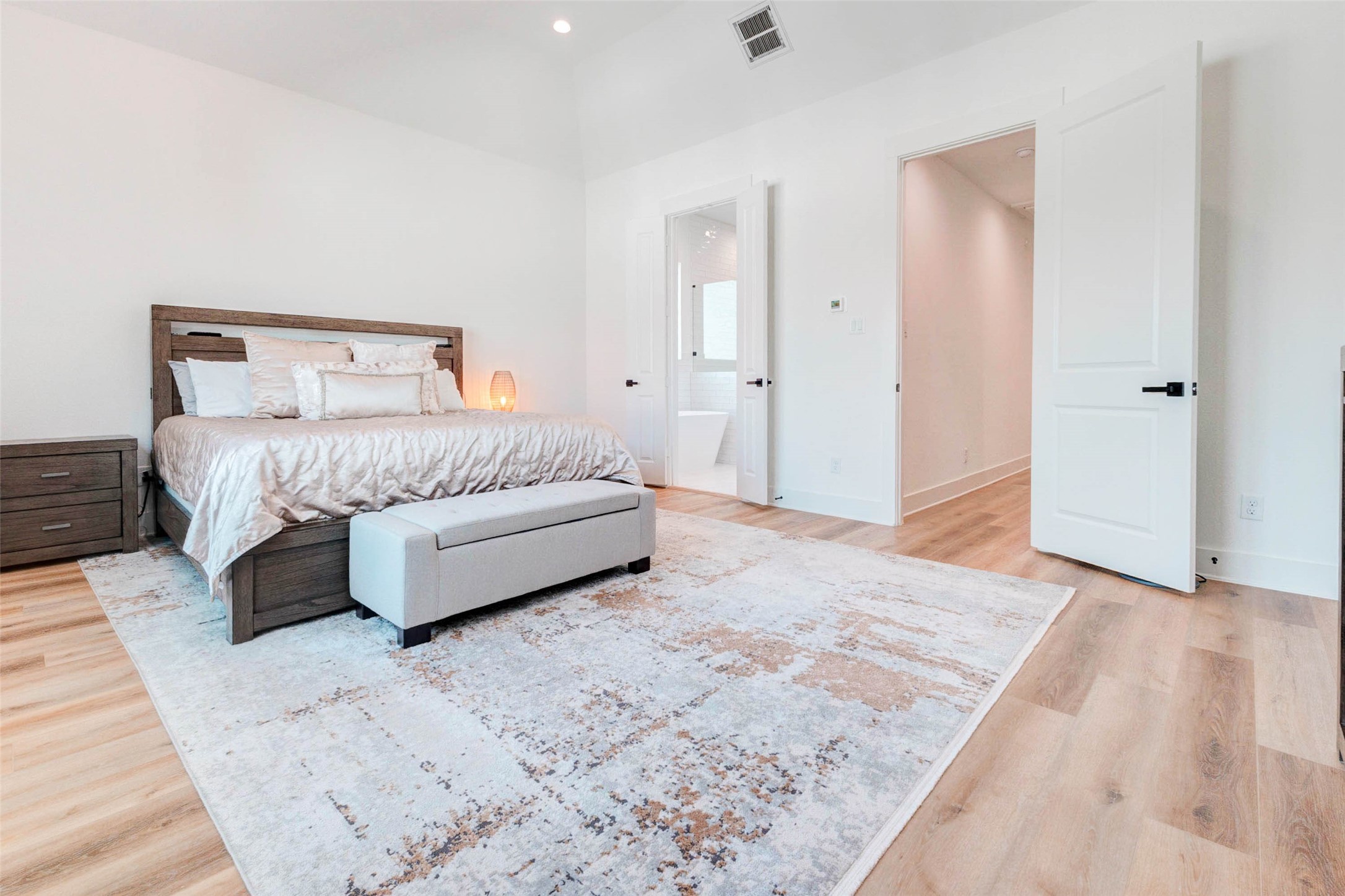 1307 East 27th Street, Unit A Houston, TX 77009 - Photo 27 of 48 a spacious bedroom with a bed and a couch