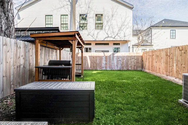 a front view of house with yard and outdoor seating
