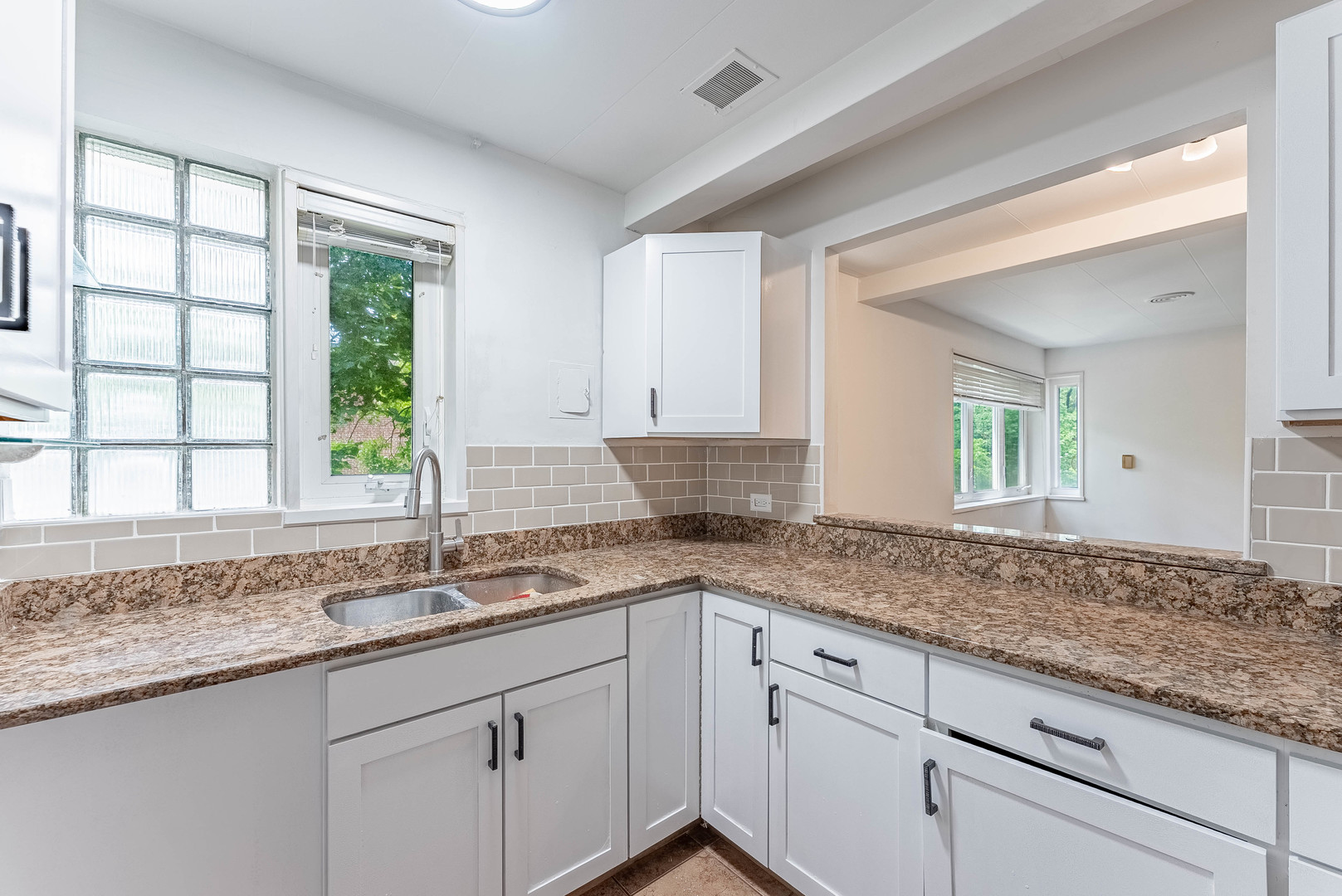 7200 Oak Avenue, Unit 3NW River Forest, IL 60305 - Photo 8 of 9 a kitchen with granite countertop sink and window