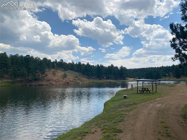 a view of a lake with a yard