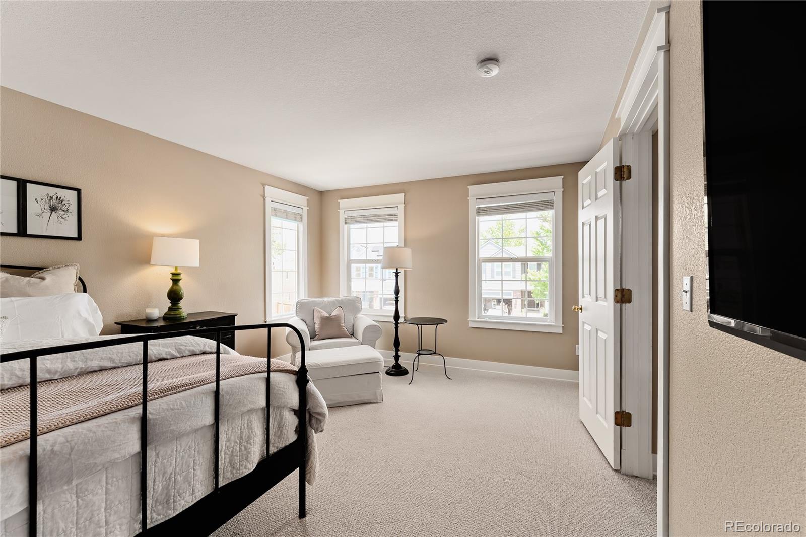 9441 South Hackberry Lane Highlands Ranch, CO 80129 - Photo 29 of 50 a bedroom with furniture and a window