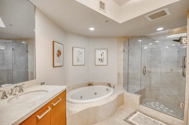 a bathroom with a bathtub and a sink
