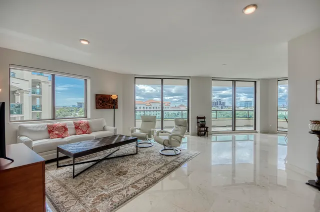 a living room with furniture and a rug