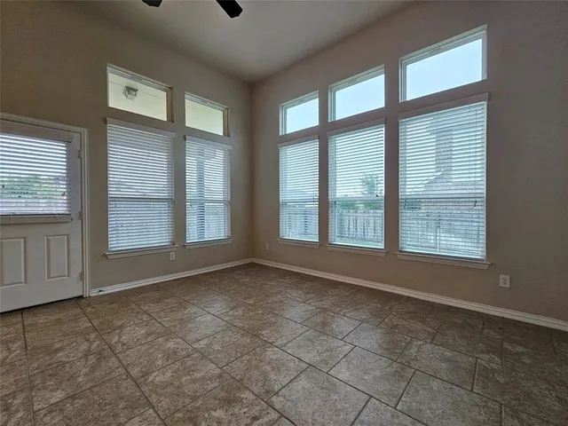 a view of a livingroom with a large window chandelier