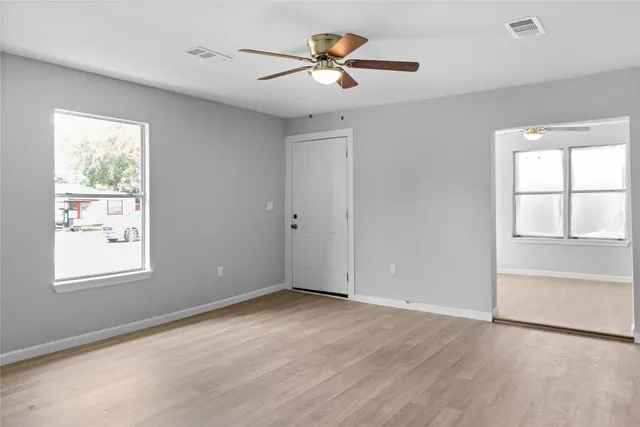 a view of an empty room with a window