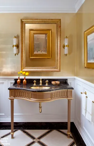 a living room with stainless steel appliances