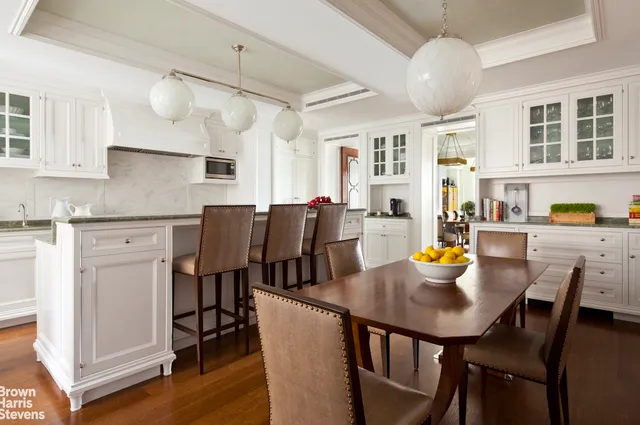 a view of kitchen with dining table and chairs