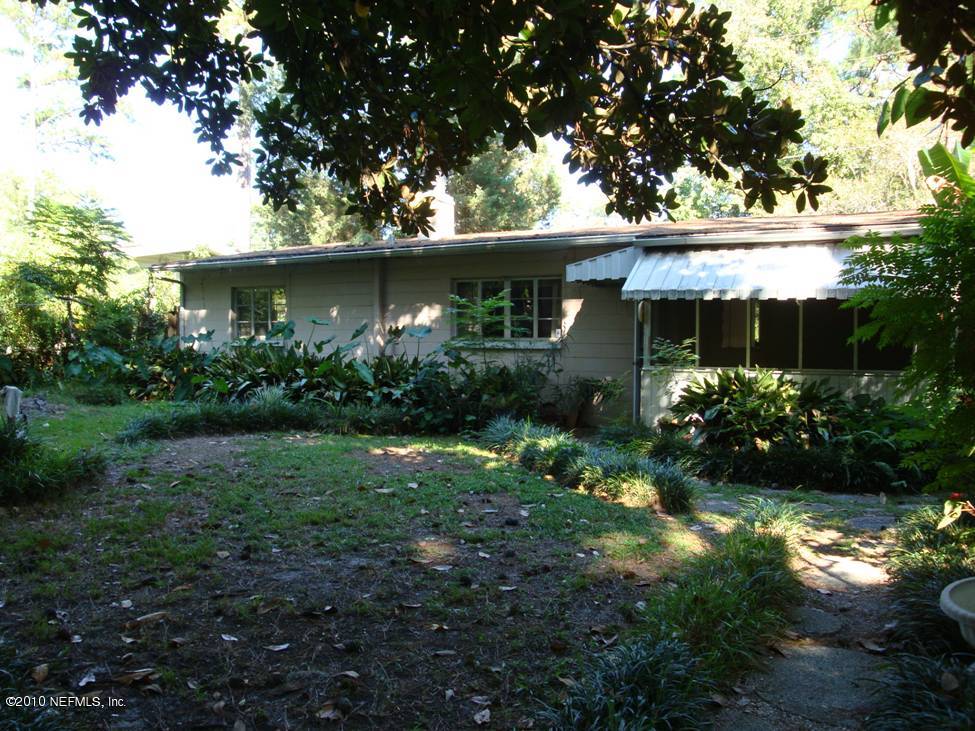 1498 Stimson Street Jacksonville, FL 32205 - Photo 2 of 6 front view of a house with a garden