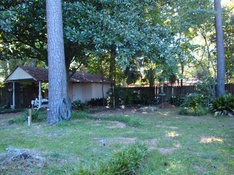 1498 Stimson Street Jacksonville, FL 32205 - Photo 3 of 6 a backyard of a house with seating space