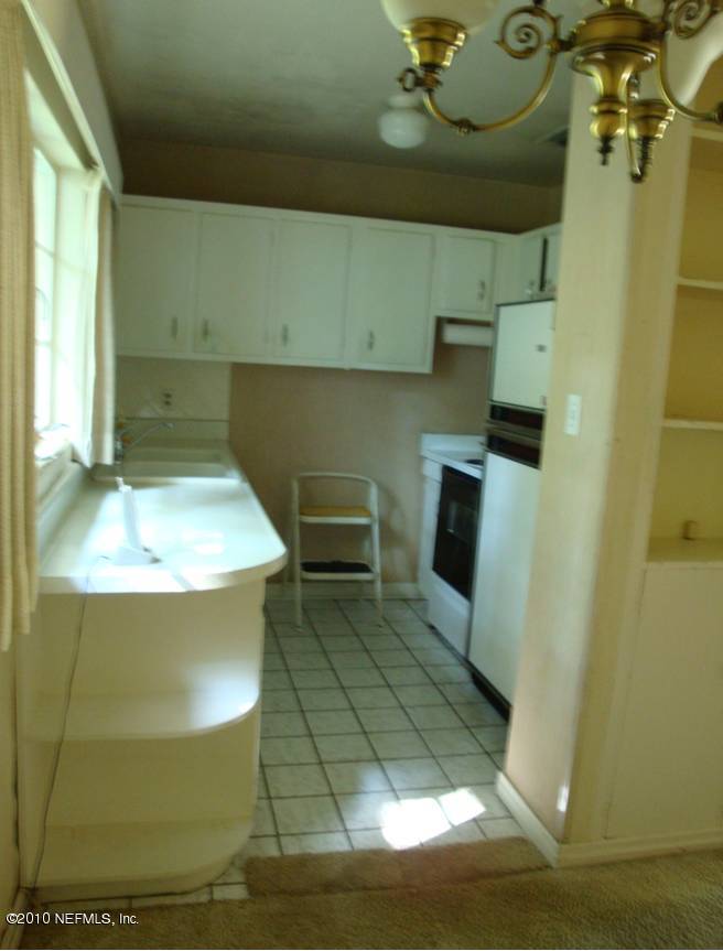 1498 Stimson Street Jacksonville, FL 32205 - Photo 5 of 6 a bathroom with a sink mirror and toilet