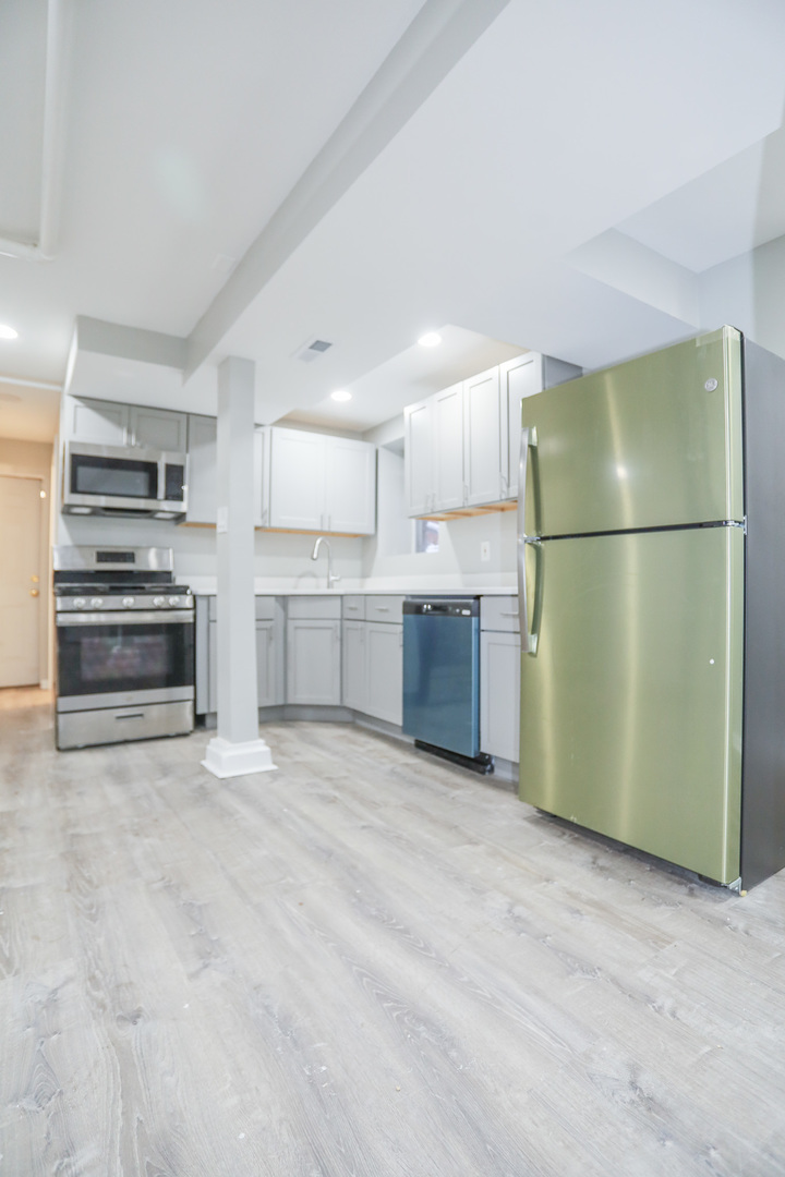 1315 West Eddy Street, Unit G Chicago, IL 60657 - Photo 3 of 9 a view of kitchen with refrigerator and cabinets