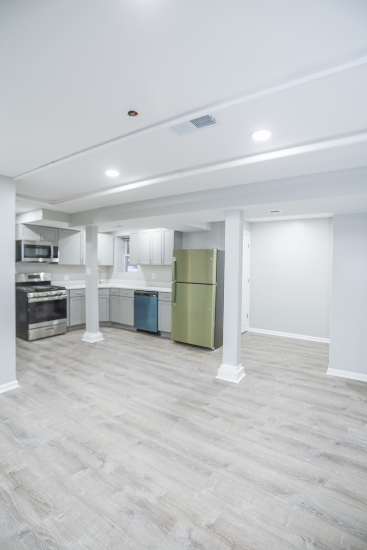 1315 West Eddy Street, Unit G Chicago, IL 60657 - Photo 4 of 9 a view of empty room with wooden floor