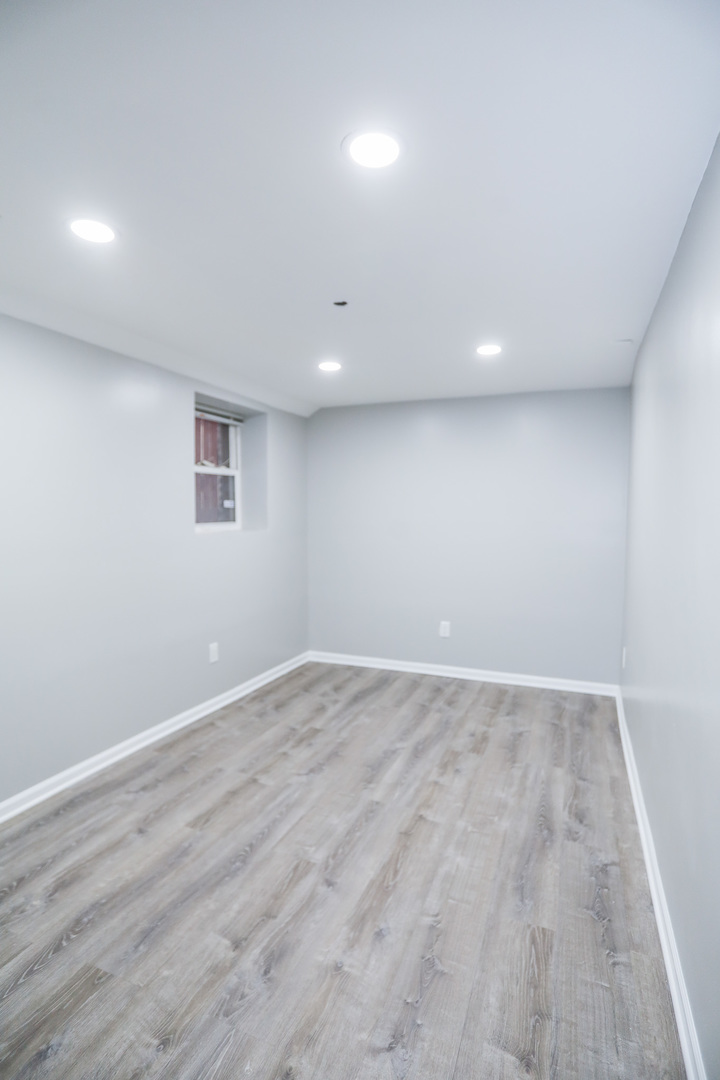 1315 West Eddy Street, Unit G Chicago, IL 60657 - Photo 7 of 9 a view of an empty room with wooden floor