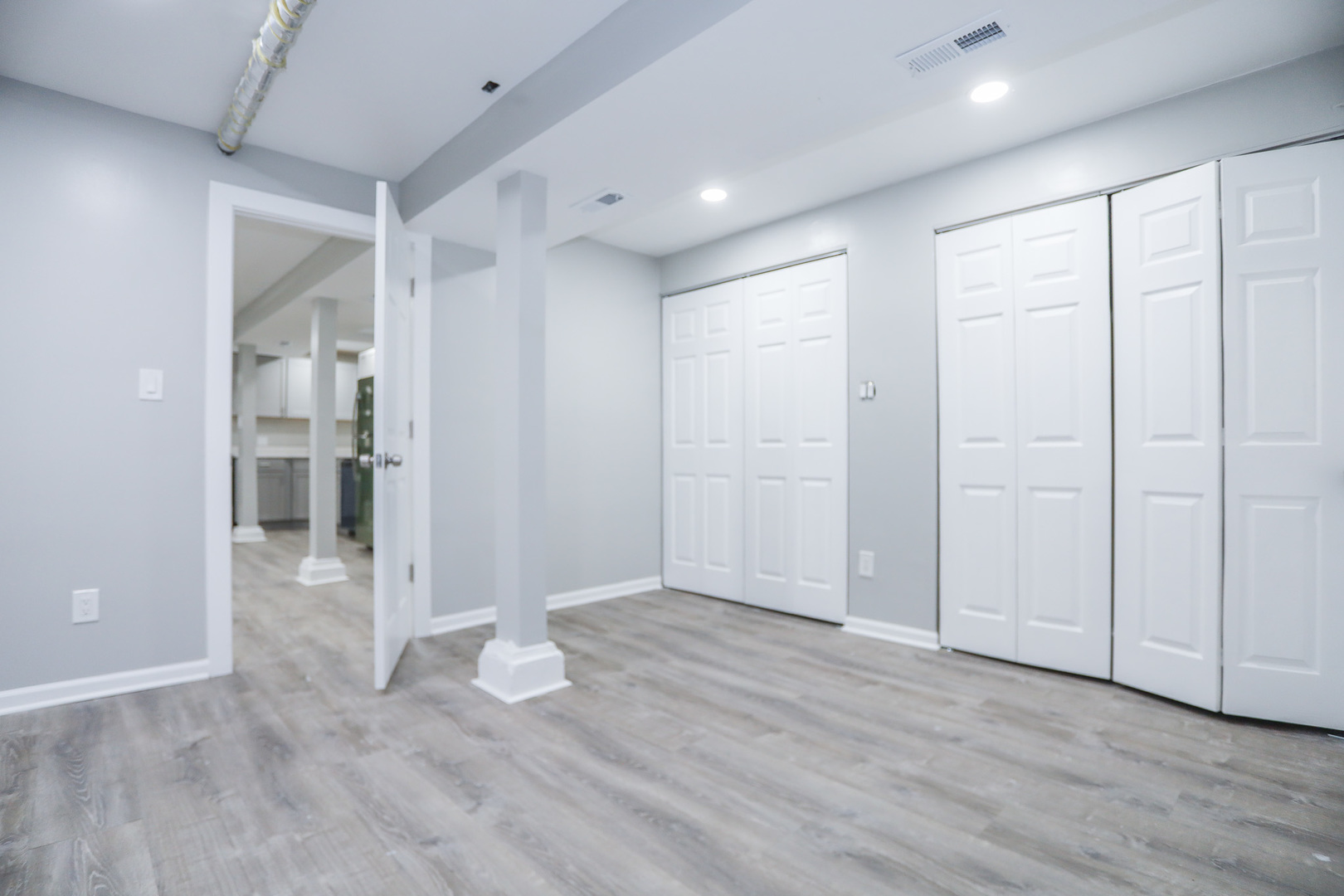 1315 West Eddy Street, Unit G Chicago, IL 60657 - Photo 9 of 9 an empty room with wooden floor and windows