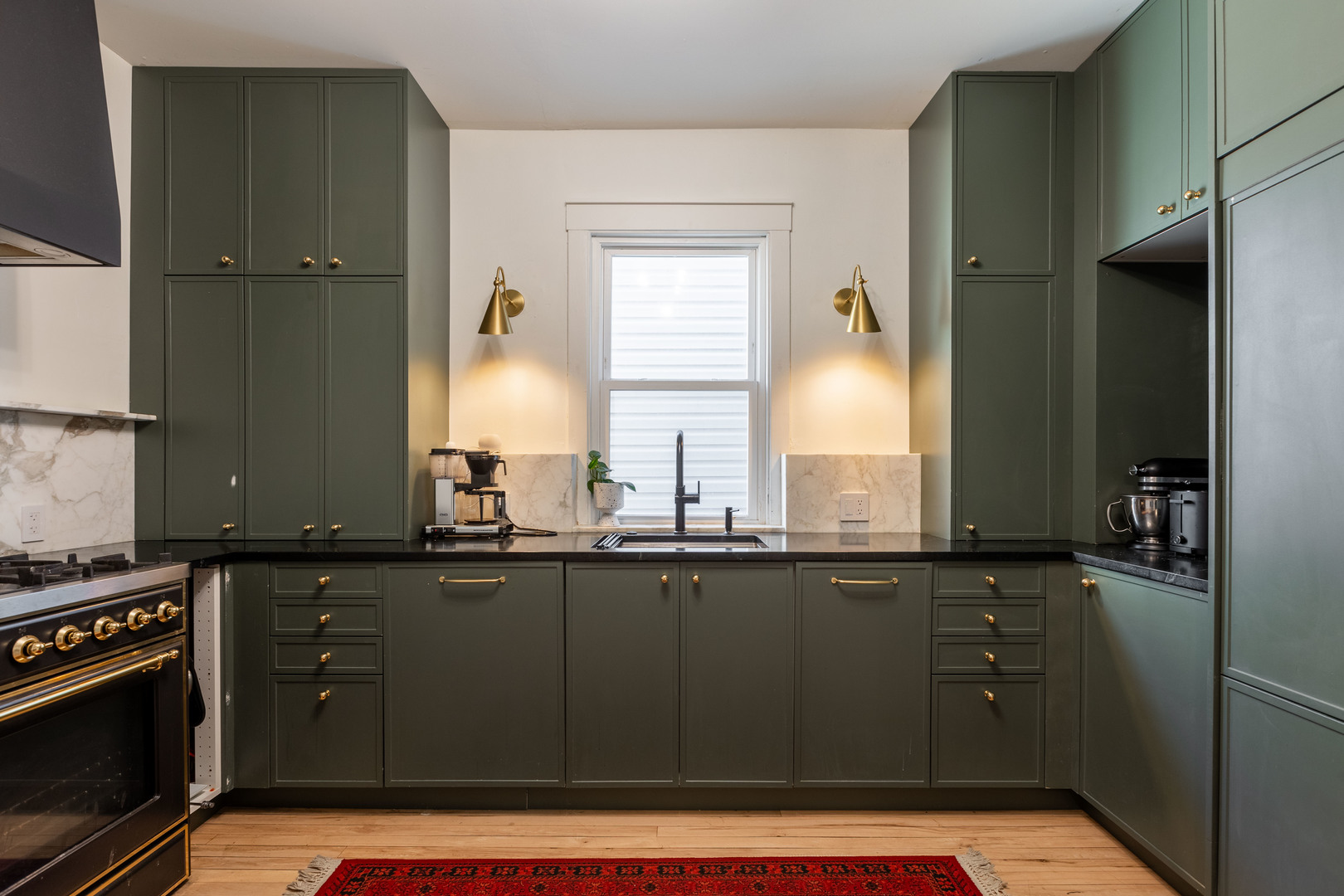 Undisclosed Address Chicago, IL 60647 - Photo 11 of 42 a kitchen with granite countertop a sink cabinets and stainless steel appliances