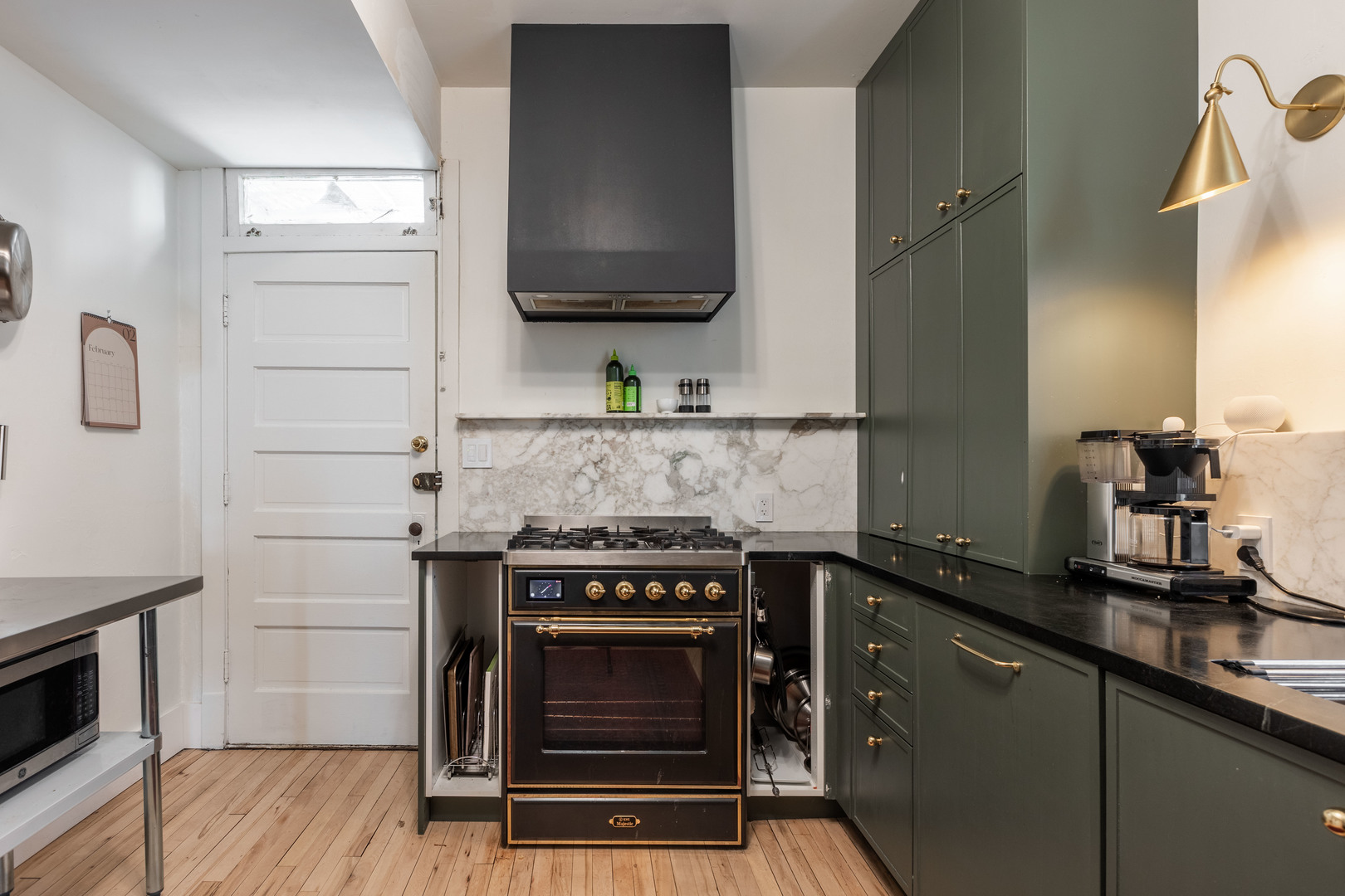 Undisclosed Address Chicago, IL 60647 - Photo 15 of 42 a kitchen with a stove and a microwave