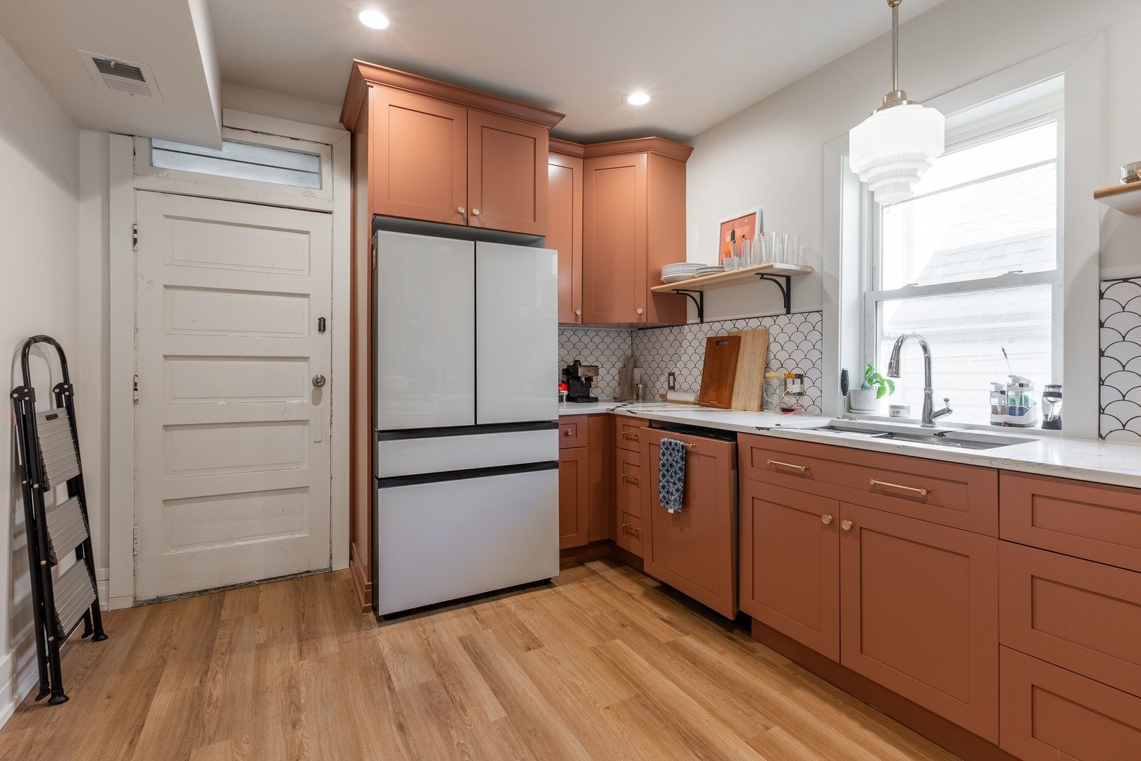 Undisclosed Address Chicago, IL 60647 - Photo 25 of 42 a kitchen with a refrigerator and a sink