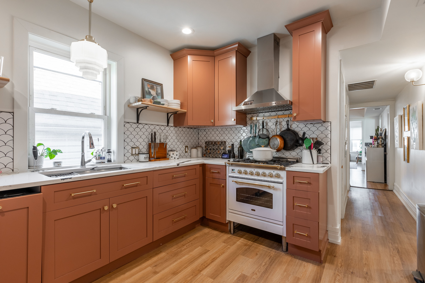 Undisclosed Address Chicago, IL 60647 - Photo 26 of 42 a kitchen with stainless steel appliances granite countertop a stove and a sink