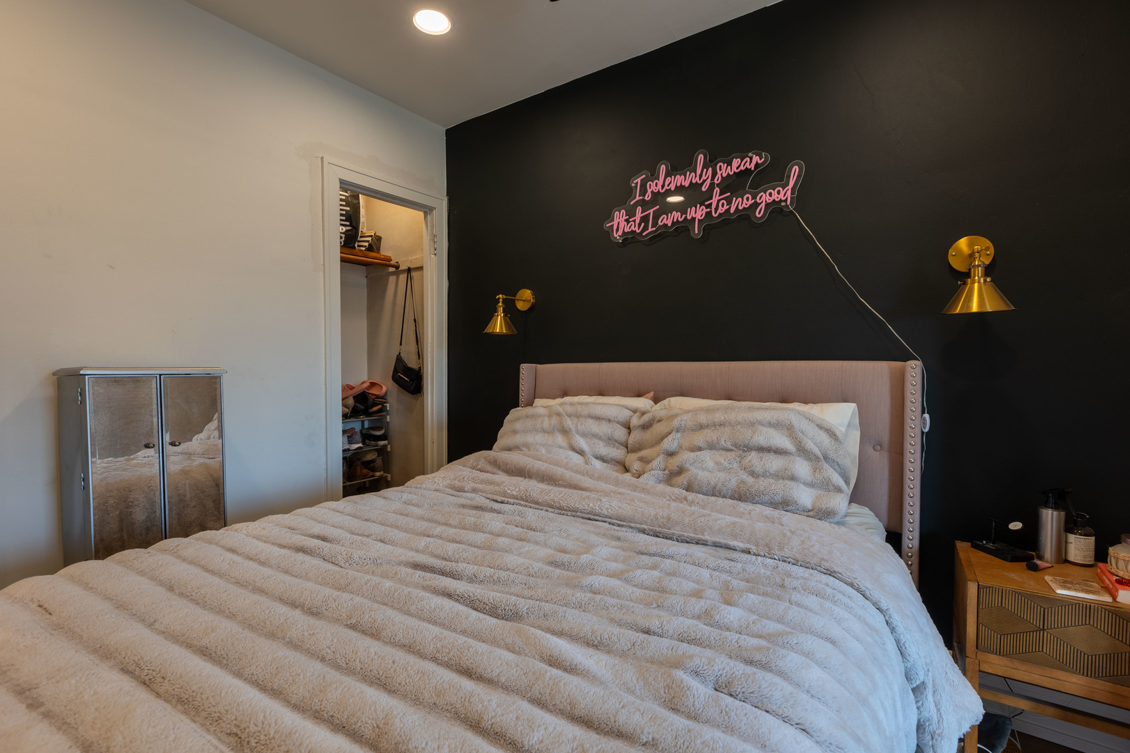 Undisclosed Address Chicago, IL 60647 - Photo 27 of 42 a bedroom with a bed and a chandelier