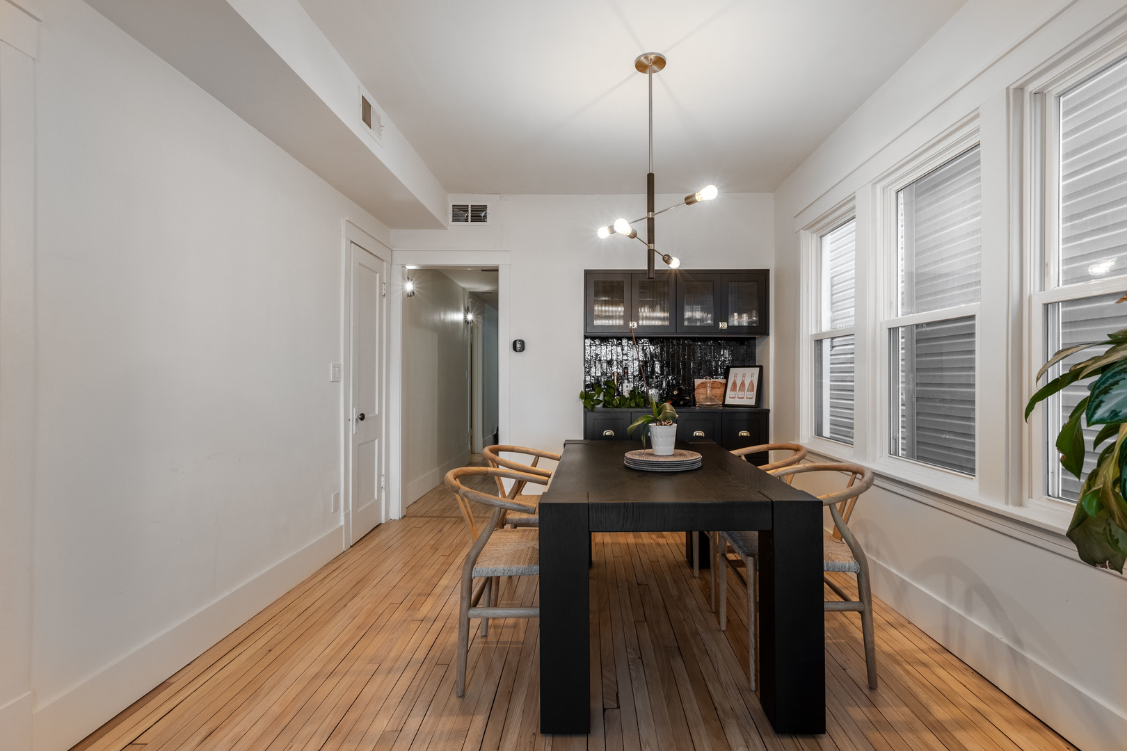 Undisclosed Address Chicago, IL 60647 - Photo 6 of 42 a view of a dining room and livingroom with furniture wooden floor a chandelier