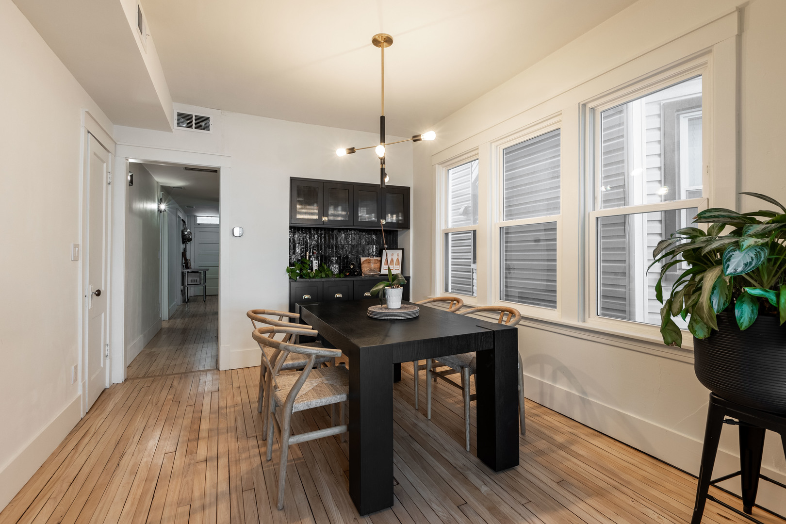Undisclosed Address Chicago, IL 60647 - Photo 7 of 42 a view of a dining room with furniture window and wooden floor