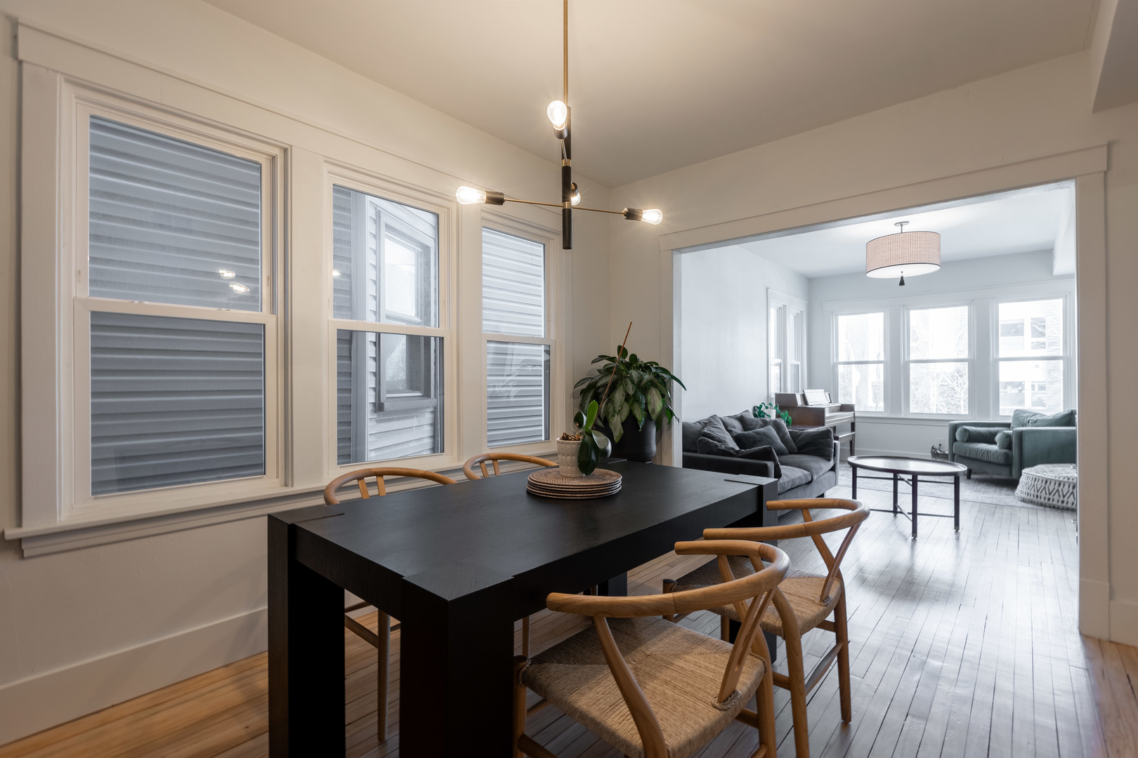 Undisclosed Address Chicago, IL 60647 - Photo 9 of 42 a view of a dining room with furniture window and wooden floor