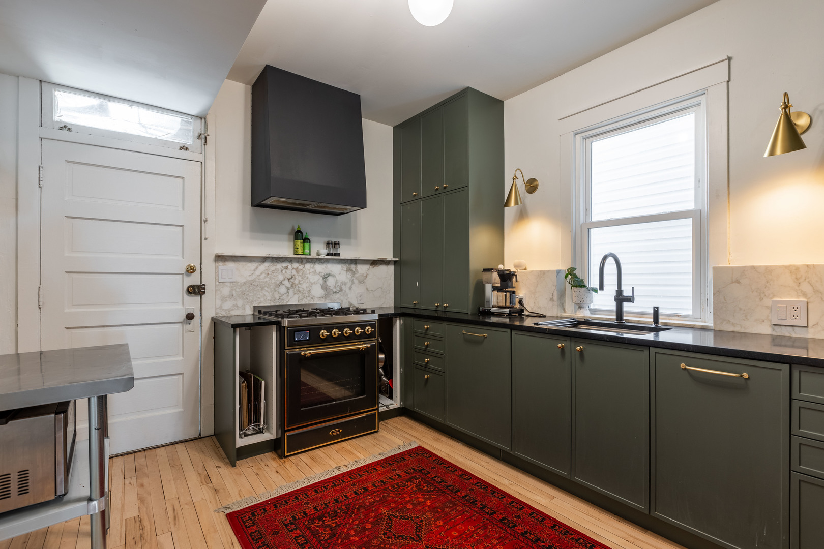 Undisclosed Address Chicago, IL 60647 - Photo 10 of 42 a kitchen with a stove oven and sink