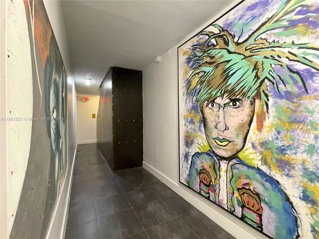 a view of car garage with painted walls