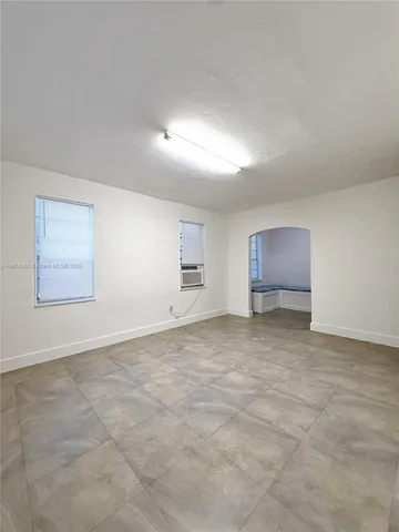 a bathroom with a toilet sink and shower