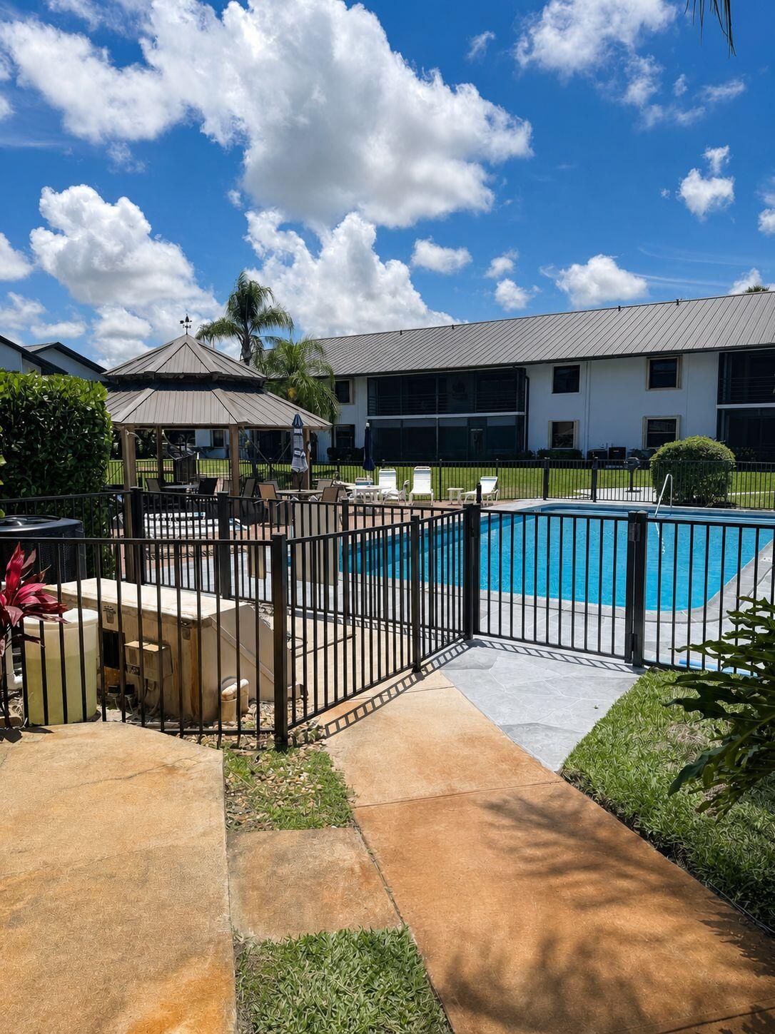 1871 Southwest Palm City Road, Unit G401 Stuart, FL 34994 - Photo 14 of 16 a view of a house with a balcony