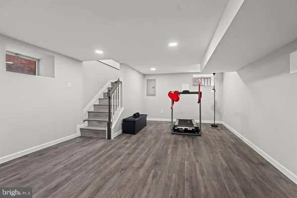 a view of a room with wooden floor and stairs