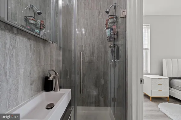 a bathroom with a bathtub and a shower