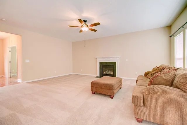 a view of a kitchen with a sink and stainless steel appliances