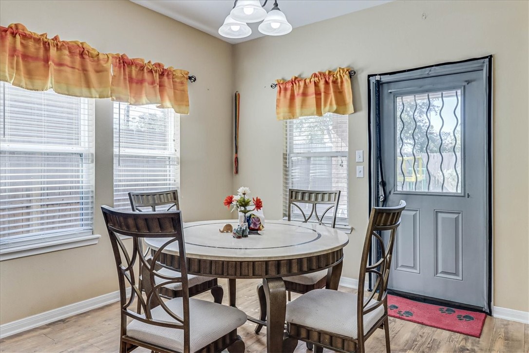 5801 Corsica Road Corpus Christi, TX 78414 - Photo 17 of 39 a dining room with furniture and window