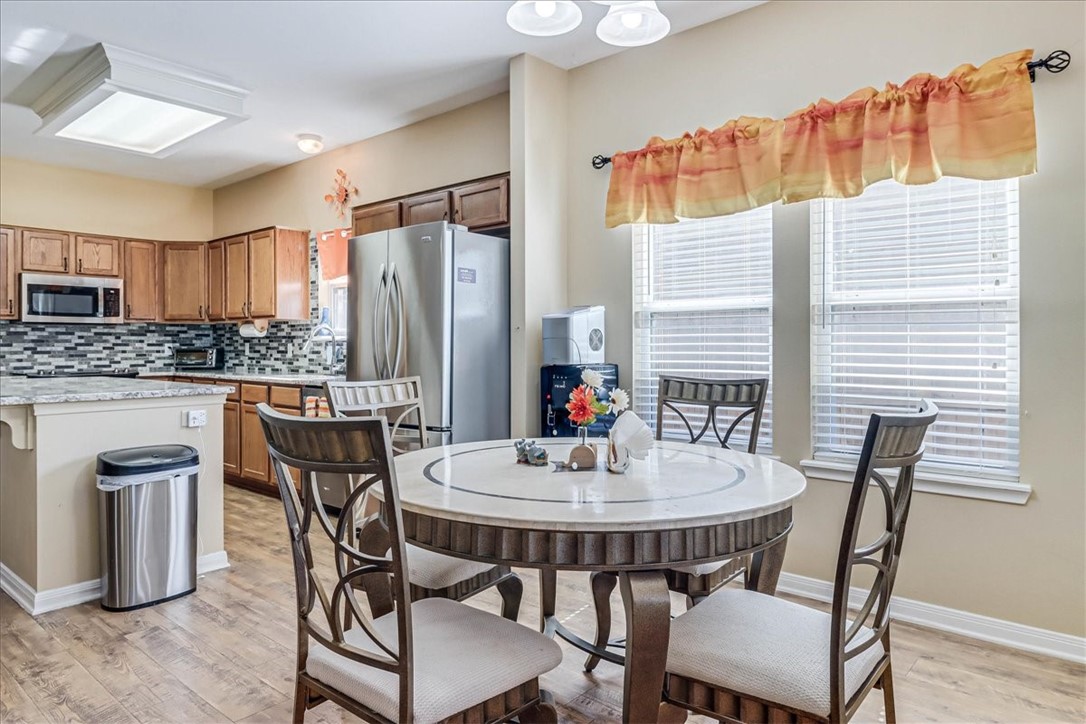 5801 Corsica Road Corpus Christi, TX 78414 - Photo 19 of 39 a dining room with furniture and window