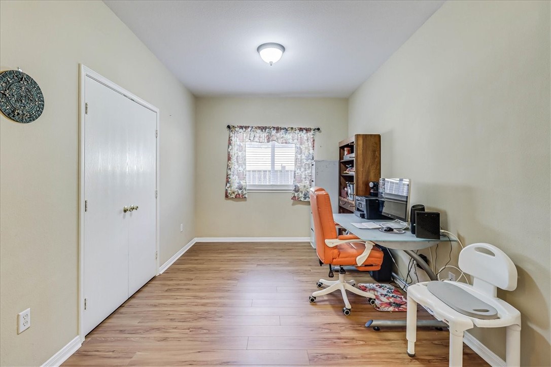 5801 Corsica Road Corpus Christi, TX 78414 - Photo 24 of 39 a view of a workspace with furniture and a window