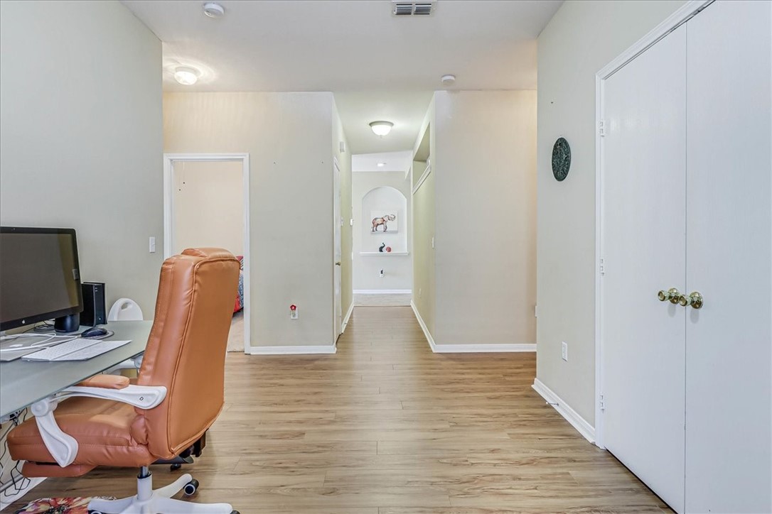 5801 Corsica Road Corpus Christi, TX 78414 - Photo 25 of 39 a view of a workspace with furniture and wooden floor
