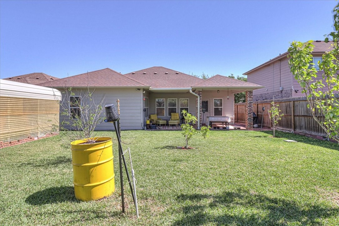 5801 Corsica Road Corpus Christi, TX 78414 - Photo 37 of 39 a view of a house with a backyard and a swimming pool