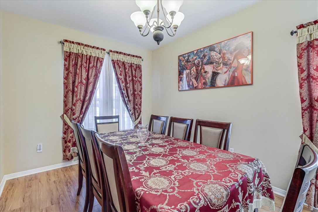 5801 Corsica Road Corpus Christi, TX 78414 - Photo 4 of 39 a bedroom with a bed and a chandelier