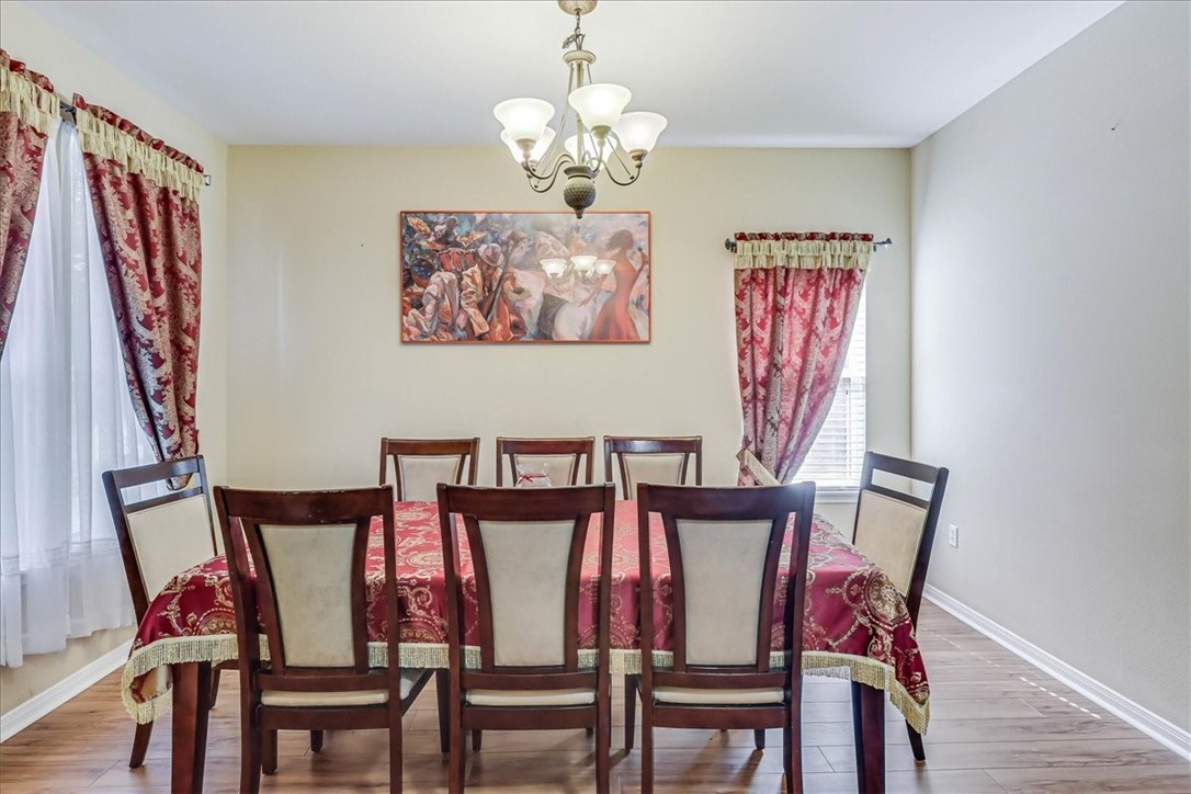 5801 Corsica Road Corpus Christi, TX 78414 - Photo 5 of 39 a view of a dining room with furniture and wooden floor