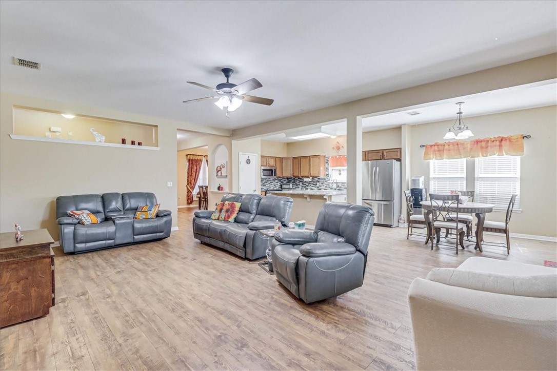 5801 Corsica Road Corpus Christi, TX 78414 - Photo 8 of 39 a living room with furniture and a large window