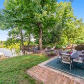 a view of a backyard with sitting area
