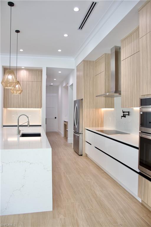 428 21st Street Southwest Naples, FL 34117 - Photo 24 of 45 a bathroom with a tub sink and mirror