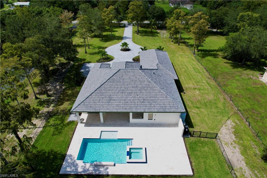 428 21st Street Southwest Naples, FL 34117 - Photo 3 of 45 an aerial view of a house with swimming pool garden and patio