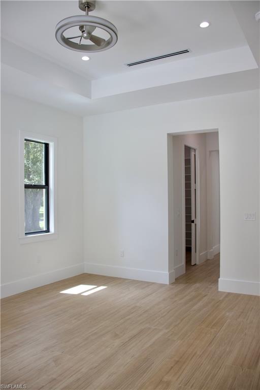 428 21st Street Southwest Naples, FL 34117 - Photo 31 of 45 an empty room with a empty space and chandelier fan