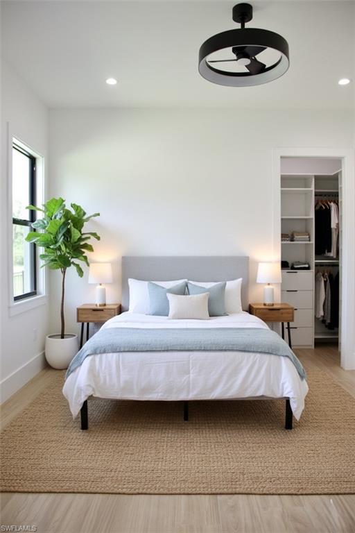 428 21st Street Southwest Naples, FL 34117 - Photo 38 of 45 a bedroom with a bed and a chandelier