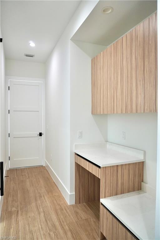 428 21st Street Southwest Naples, FL 34117 - Photo 39 of 45 a hallway with wooden floor