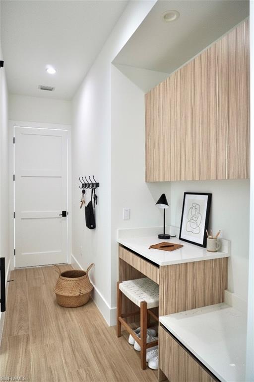 428 21st Street Southwest Naples, FL 34117 - Photo 40 of 45 a room with a table chairs and wooden floor