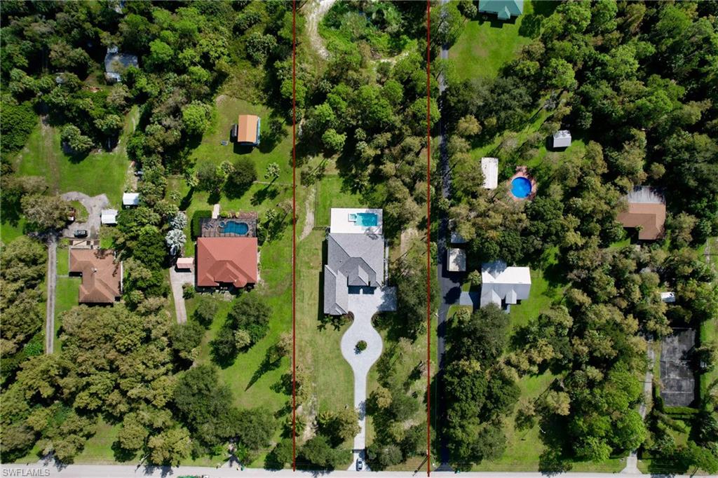 428 21st Street Southwest Naples, FL 34117 - Photo 45 of 45 an aerial view of residential house with outdoor space and trees all around